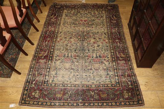 A Caucasian rug with triple medallion on a blue ground and two worn Persian rugs 210 x 120cm, 205 x 135cm and 195 x 145cm